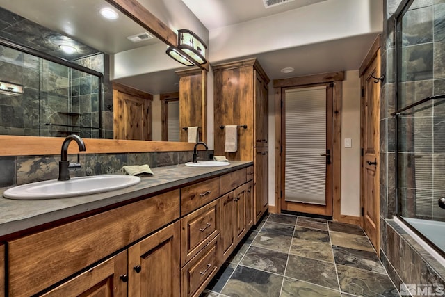 bathroom with enclosed tub / shower combo and vanity