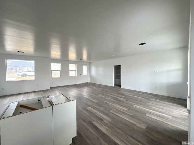 unfurnished living room featuring hardwood / wood-style flooring