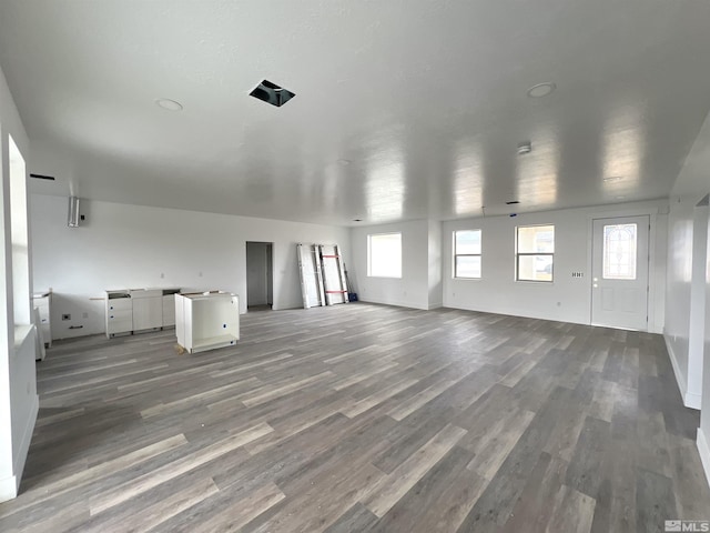 unfurnished living room featuring hardwood / wood-style flooring