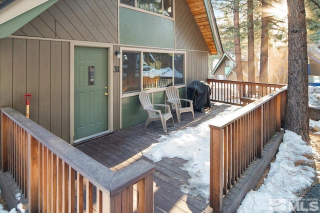 wooden terrace featuring area for grilling