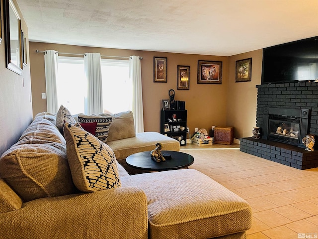 living room featuring a fireplace and light tile patterned floors