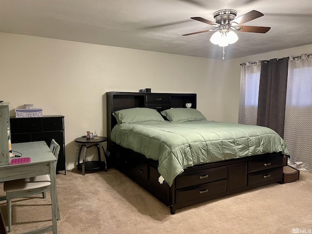 bedroom with light carpet and ceiling fan