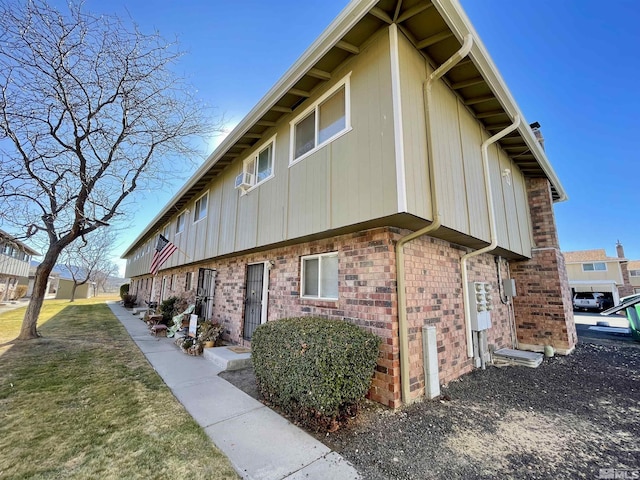 view of side of property with a yard