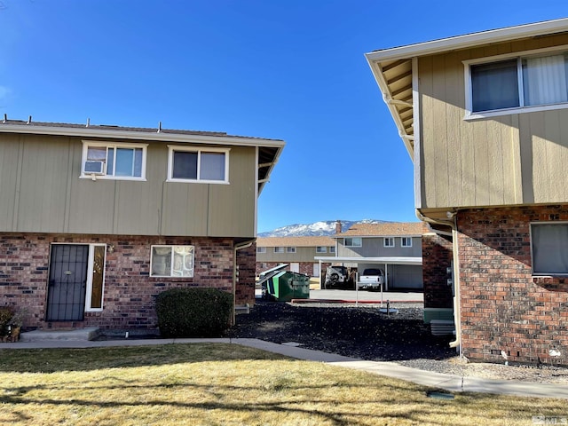 view of side of property featuring a yard