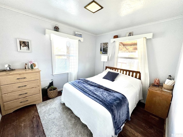 bedroom featuring ornamental molding and dark hardwood / wood-style floors