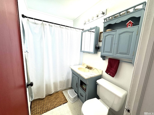 bathroom with toilet, curtained shower, and vanity