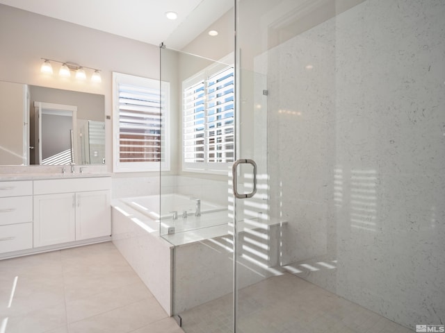 bathroom with separate shower and tub, vanity, and tile patterned floors