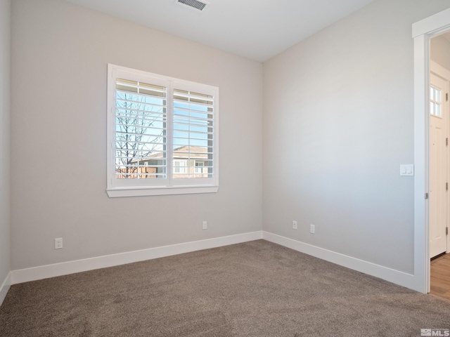 spare room with carpet floors