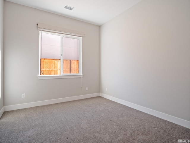 empty room featuring carpet flooring