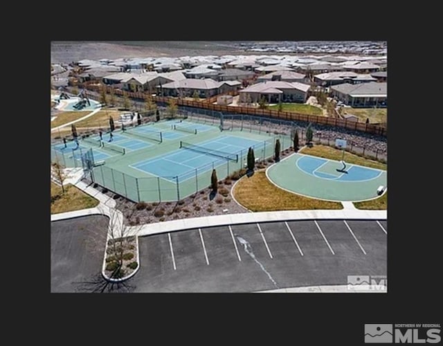 view of sport court featuring basketball hoop