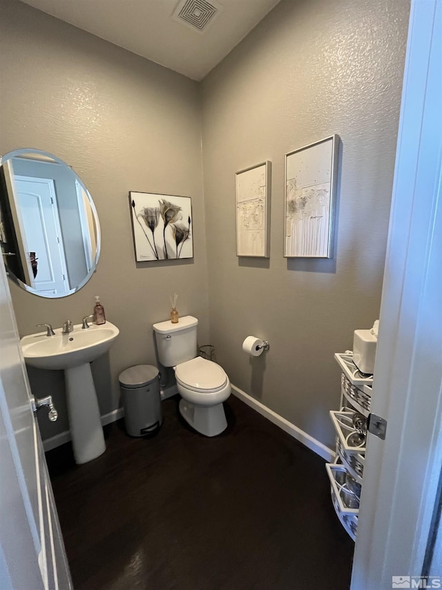 bathroom featuring sink and toilet