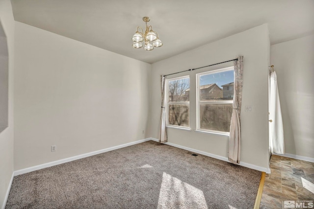 unfurnished room featuring carpet floors and a notable chandelier