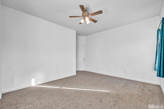 empty room with ceiling fan and carpet