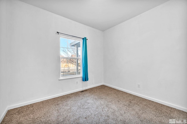 unfurnished room with carpet