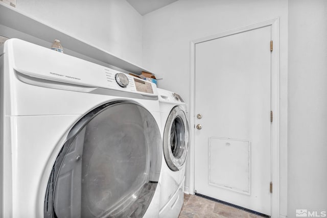 laundry area with washer and clothes dryer