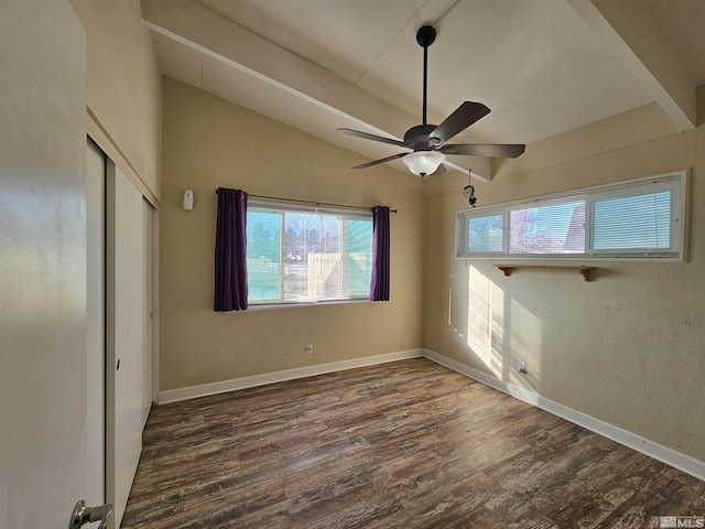 unfurnished bedroom with multiple windows, ceiling fan, vaulted ceiling, and dark hardwood / wood-style floors