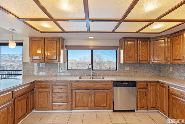 kitchen with sink, backsplash, dishwasher, and hanging light fixtures