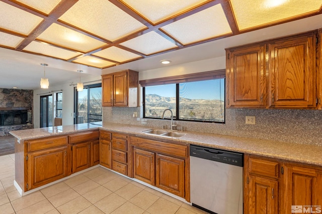 kitchen with sink, dishwasher, backsplash, and kitchen peninsula