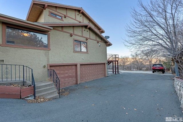 view of side of property featuring a garage