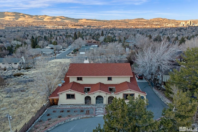 drone / aerial view featuring a mountain view