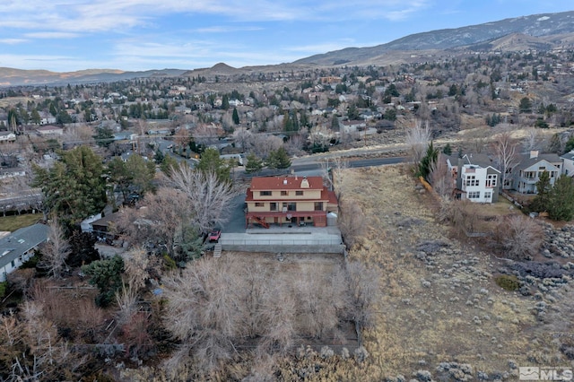 birds eye view of property with a mountain view