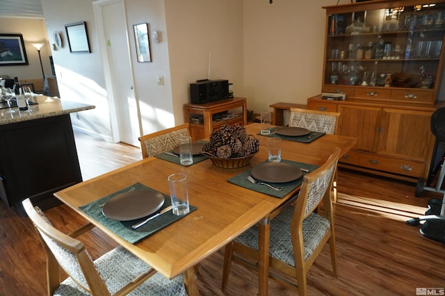 dining area featuring hardwood / wood-style flooring