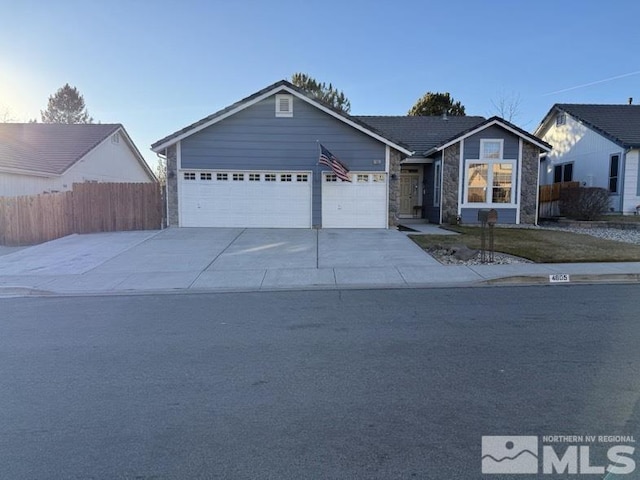 ranch-style house featuring a garage