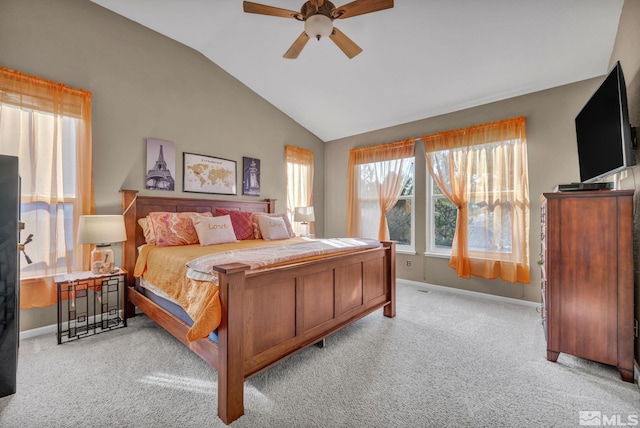 bedroom with lofted ceiling, ceiling fan, and light colored carpet