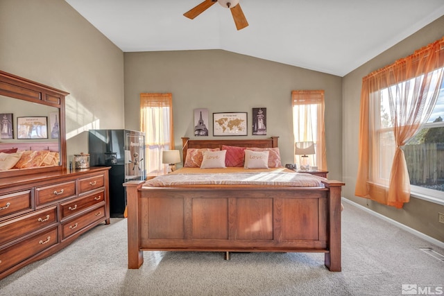 bedroom with lofted ceiling, light carpet, and ceiling fan