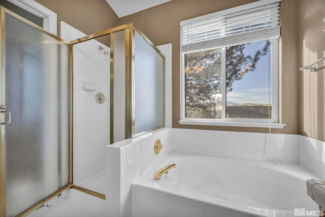 bathroom with separate shower and tub