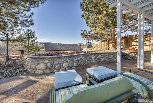 view of patio / terrace with an outdoor hangout area and a pergola