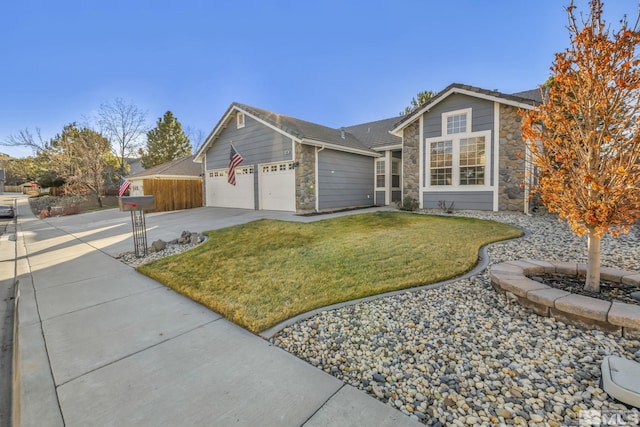 ranch-style home featuring a front lawn and a garage