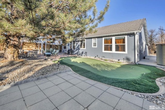 back of house featuring a patio