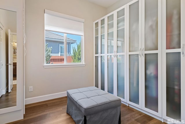 living area with hardwood / wood-style flooring