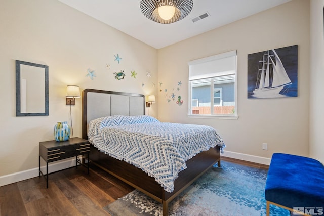 bedroom with ceiling fan and dark hardwood / wood-style flooring