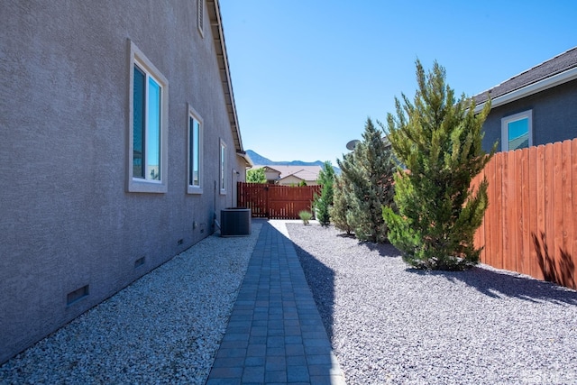 view of yard featuring a patio and central AC unit