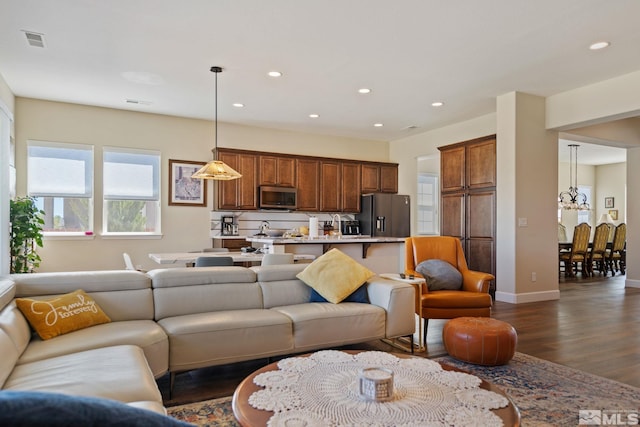 living room featuring dark hardwood / wood-style flooring