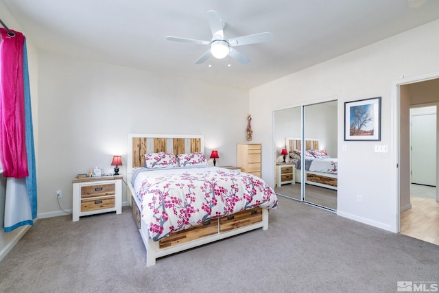 carpeted bedroom with a closet and ceiling fan