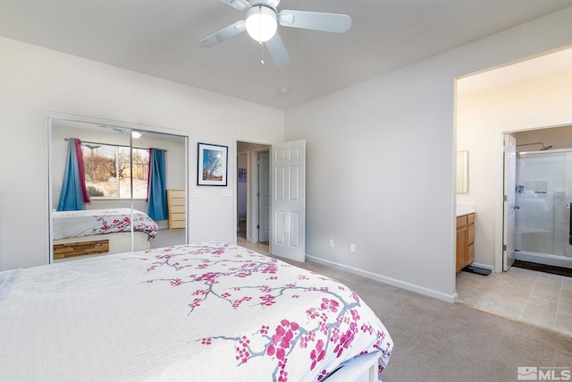 carpeted bedroom featuring ceiling fan and connected bathroom