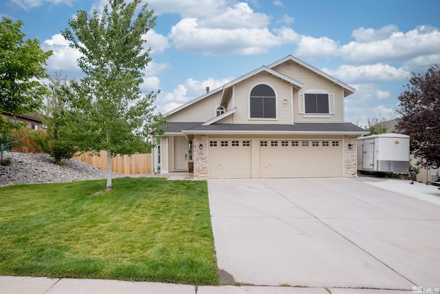 view of front facade featuring a front yard and a garage