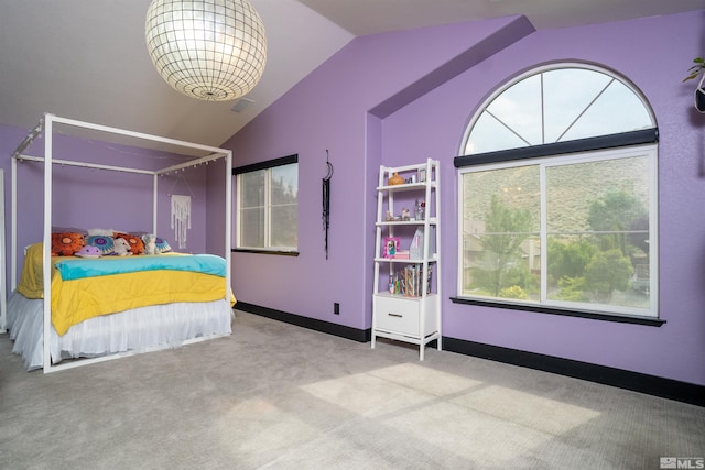 unfurnished bedroom featuring carpet floors and vaulted ceiling