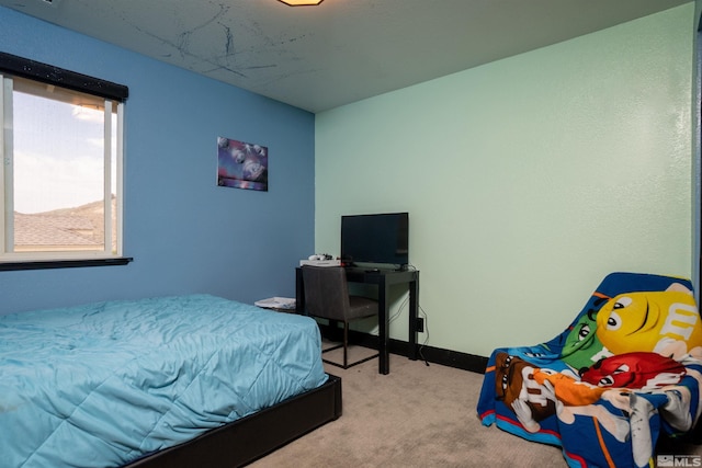 bedroom featuring light carpet