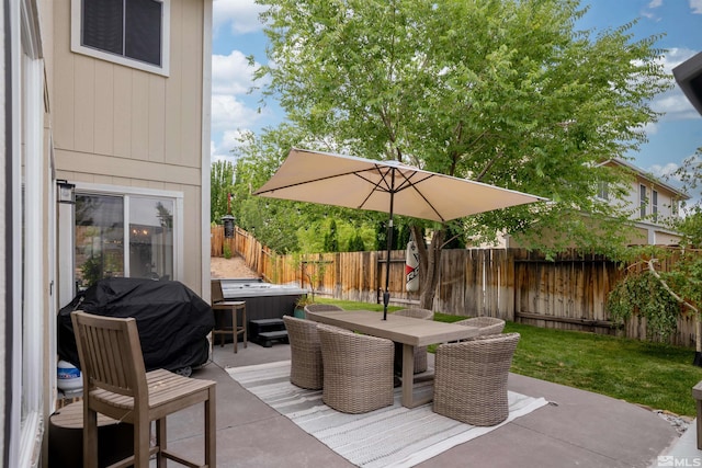 view of patio / terrace with a hot tub