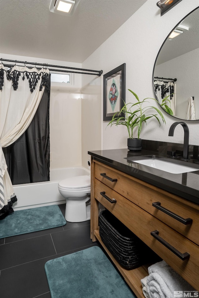 full bathroom featuring toilet, a textured ceiling, tile patterned flooring, shower / tub combo, and vanity