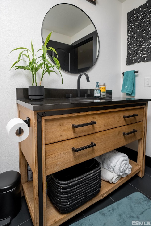 bathroom featuring vanity and tile patterned flooring