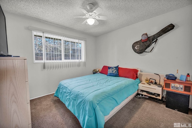 carpeted bedroom featuring a textured ceiling and ceiling fan