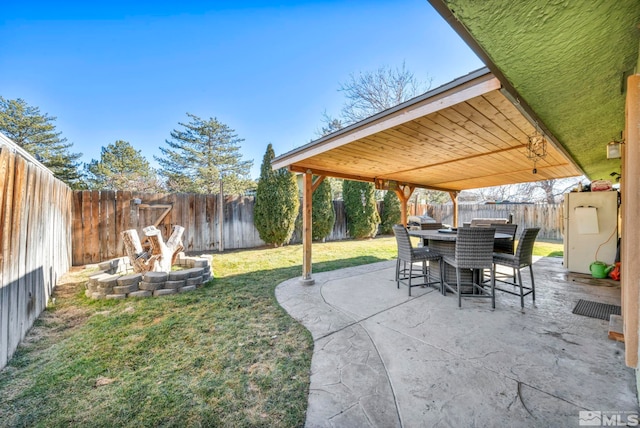 view of patio / terrace featuring a fire pit