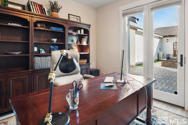 office space with light hardwood / wood-style floors