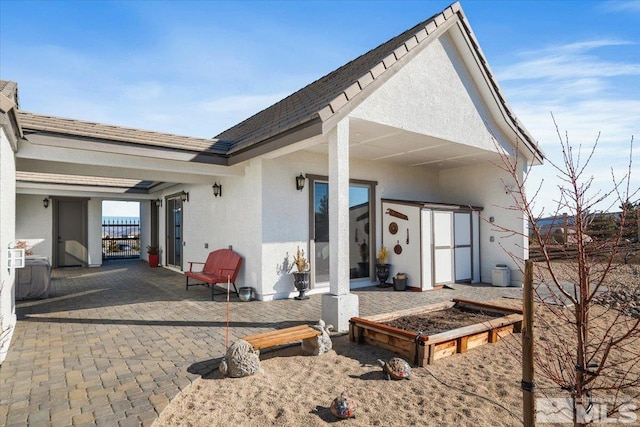 rear view of property with a patio area