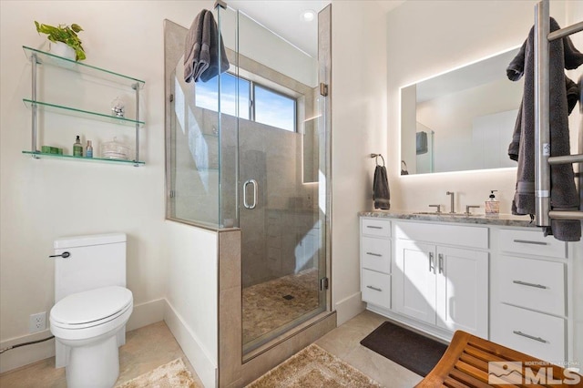 bathroom with tile patterned floors, an enclosed shower, vanity, and toilet